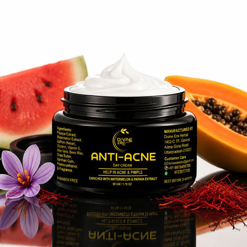 A jar of Divine Elegance Anti-Acne Day Cream with white cream visible at the top, set against a white background with watermelon, papaya, a purple flower, and red stigmas as decorative props.