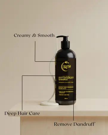 Divine Era Herbal Anti-Dandruff Shampoo bottle dispensing creamy, smooth shampoo, with text highlighting "Creamy & Smooth," "Deep Hair Care," and "Remove Dandruff" benefits.