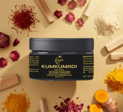 Luxurious flat lay of Divine Era Herbal Kumkumadi Cream for Face jar on a golden background, surrounded by authentic Ayurvedic ingredients: saffron threads, rose petals, sandalwood sticks, and turmeric roots.
